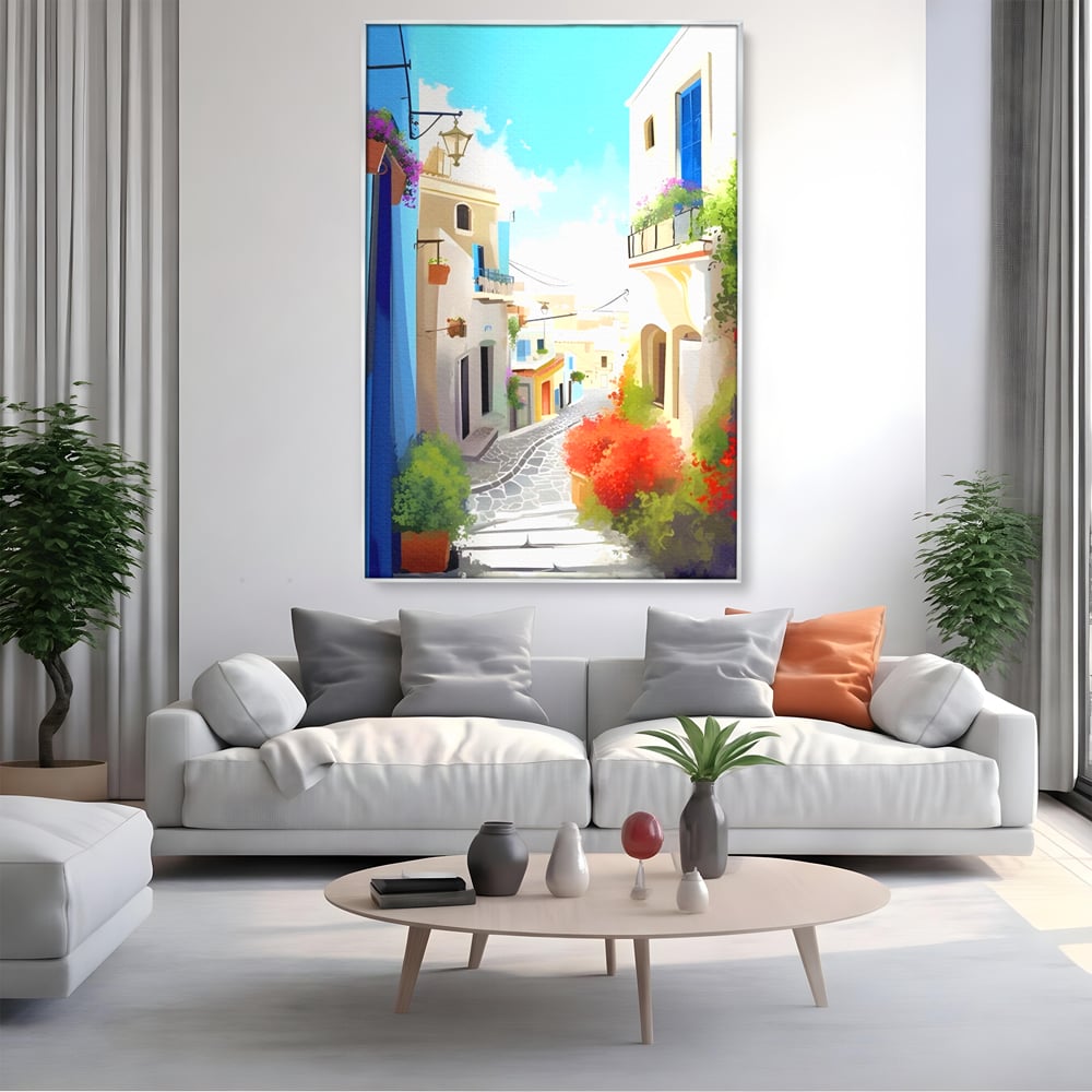 Tablou canvas cu ilustratie digitala cu strada mediteraneana, in rama de aluminiu argintiu, pe perete intr-un living